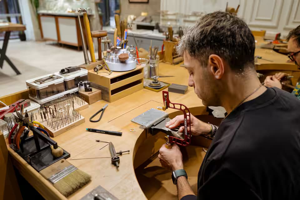 Craft a silver pendant with a master jeweler